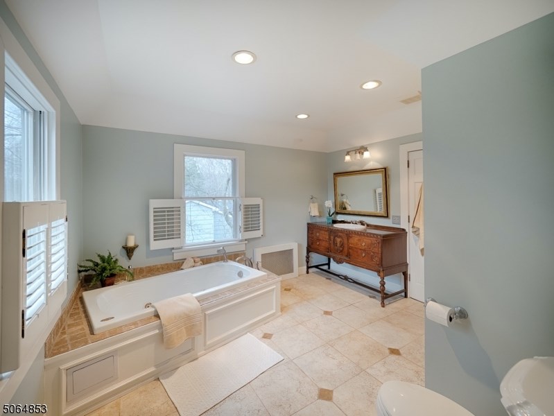 View of a luxury master bathroom staged and ready to sell