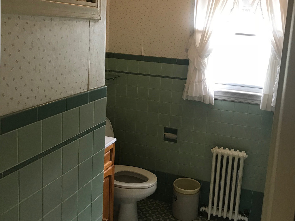 View of first floor bathroom before the home was staged by eStaged Homes