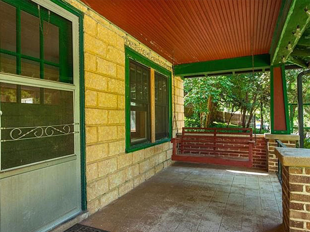View of 125 Naples Road's front porch before home staging