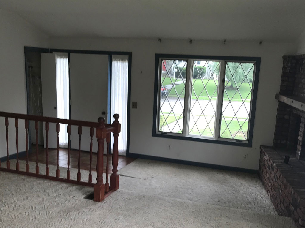 View of the living room at 154 Kenmore Rd. before home staging